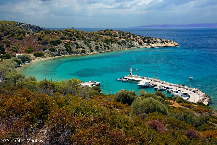 Turquoise bay with pier on Mediterranean island for beach exploration
