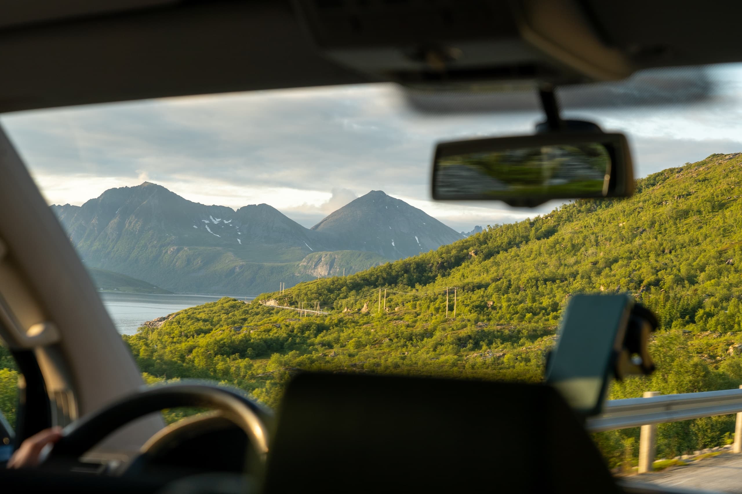Mountain road view from inside car, scenic coastal driving