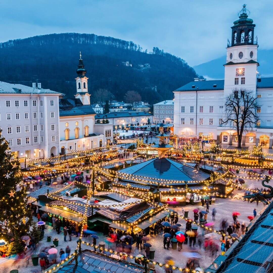 Aerial view of festive European Christmas market in alpine town
