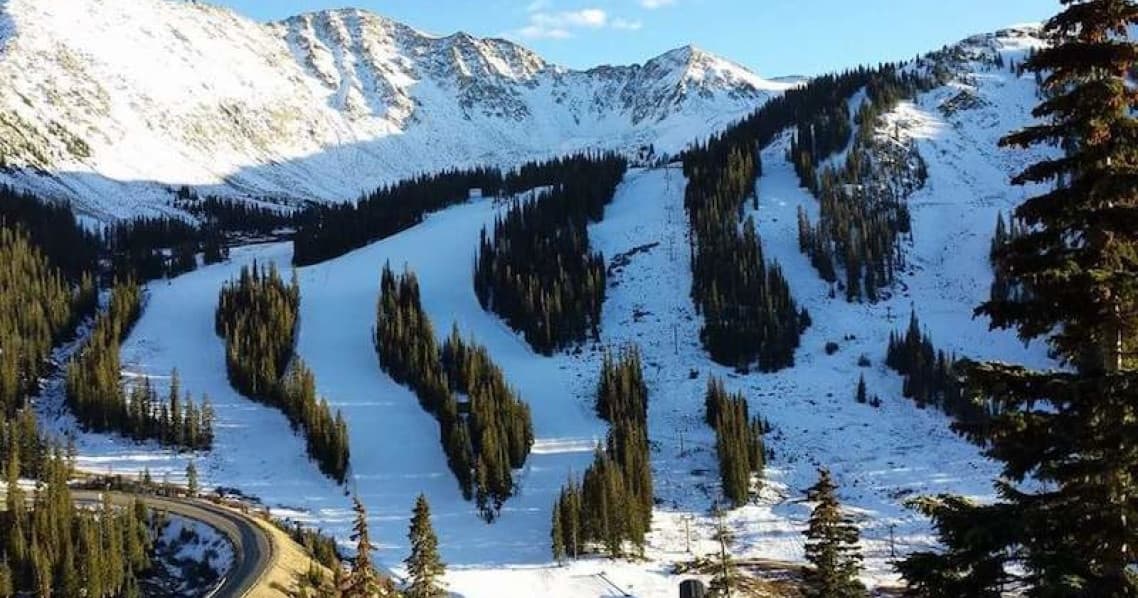 Ski runs and chairlifts on snowy mountain, Colorado alpine skiing
