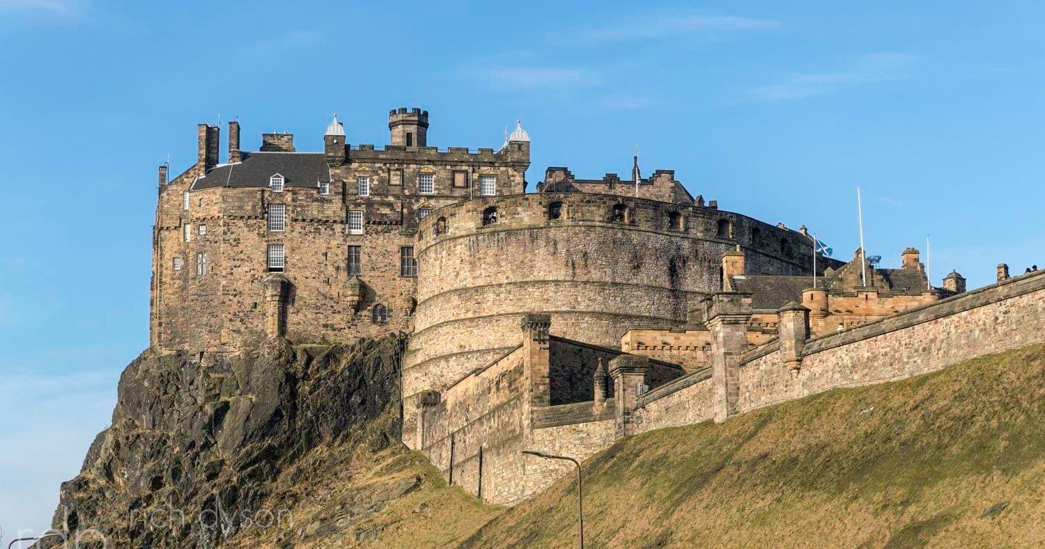 Edinburgh Castle on rocky hilltop, dramatic city skyline view