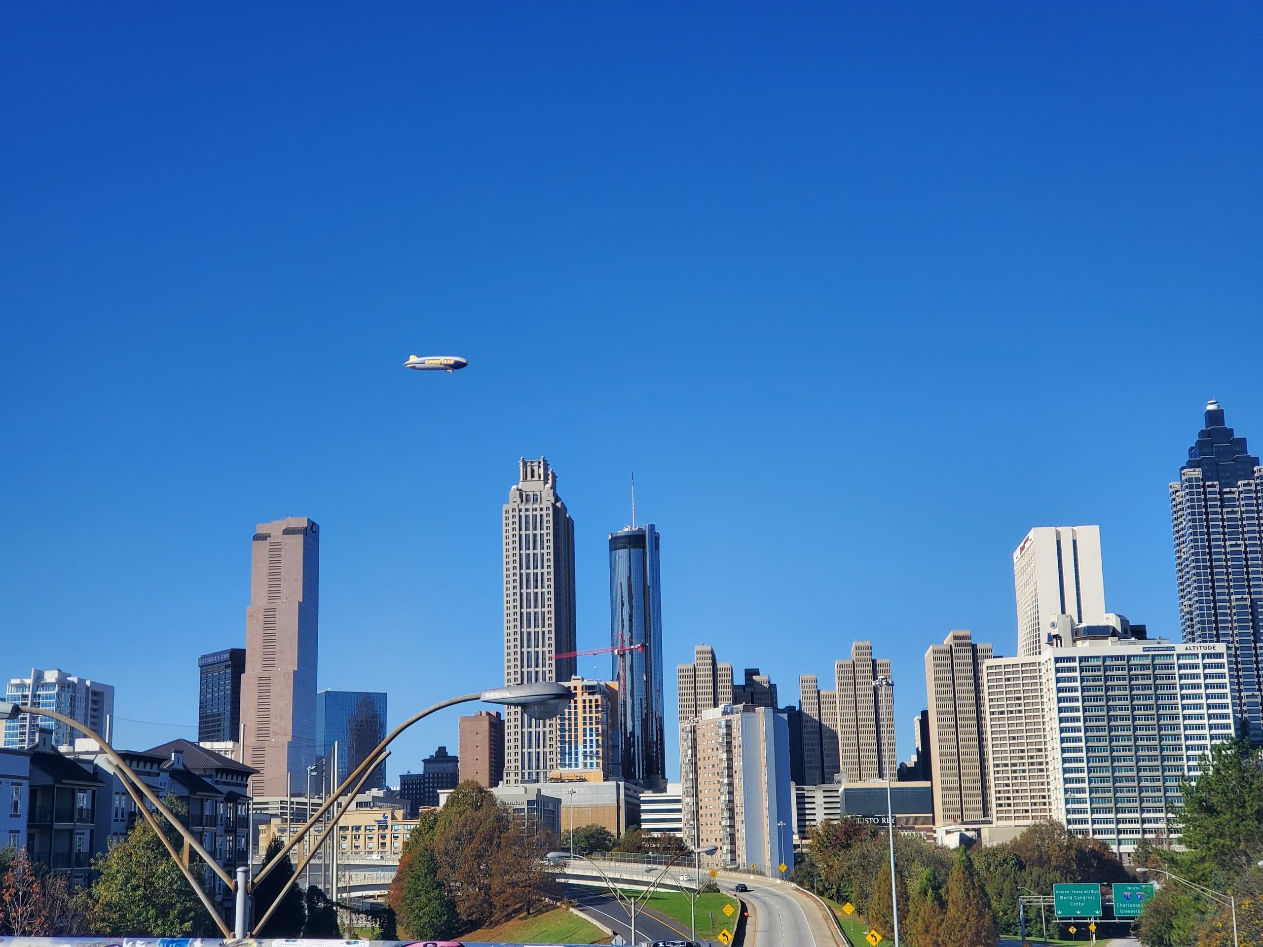 Panoramic Atlanta city skyline view with airplane over downtown