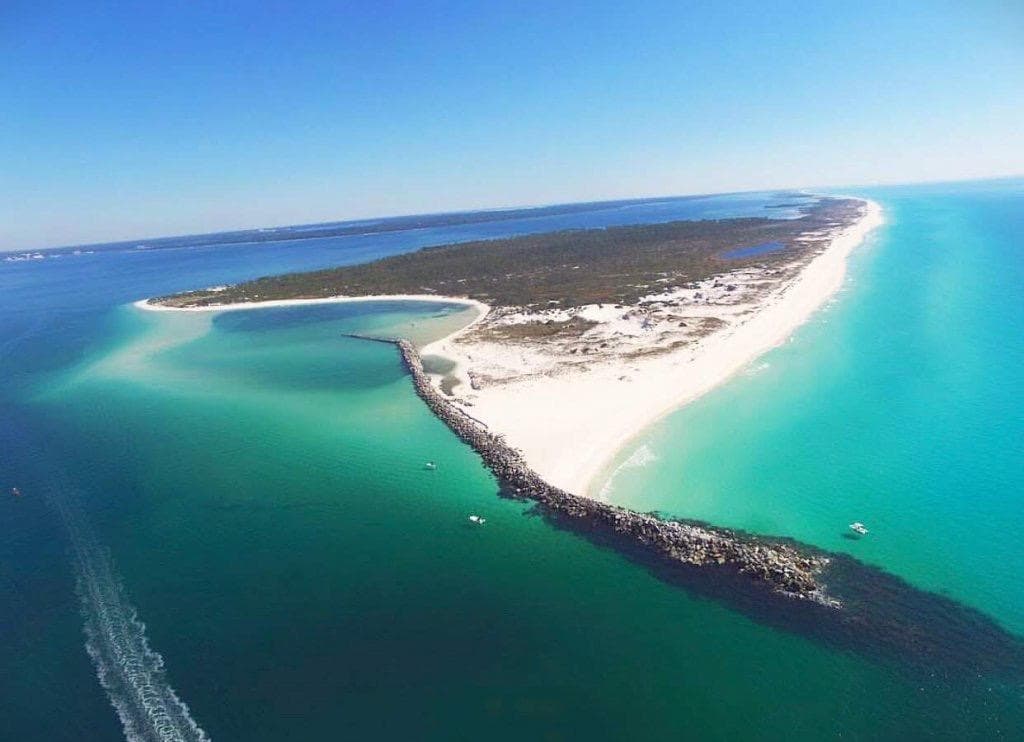 Aerial view of turquoise barrier island and sandy beach coastline