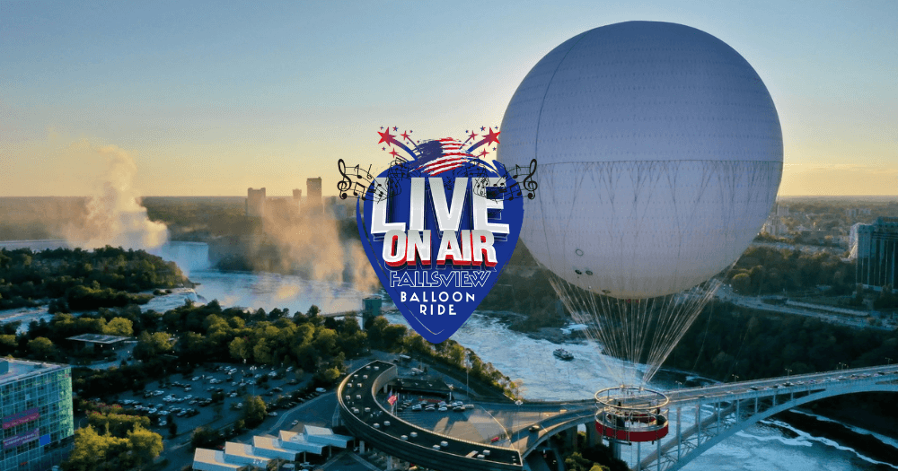 Tethered hot air balloon ride over riverside city skyline