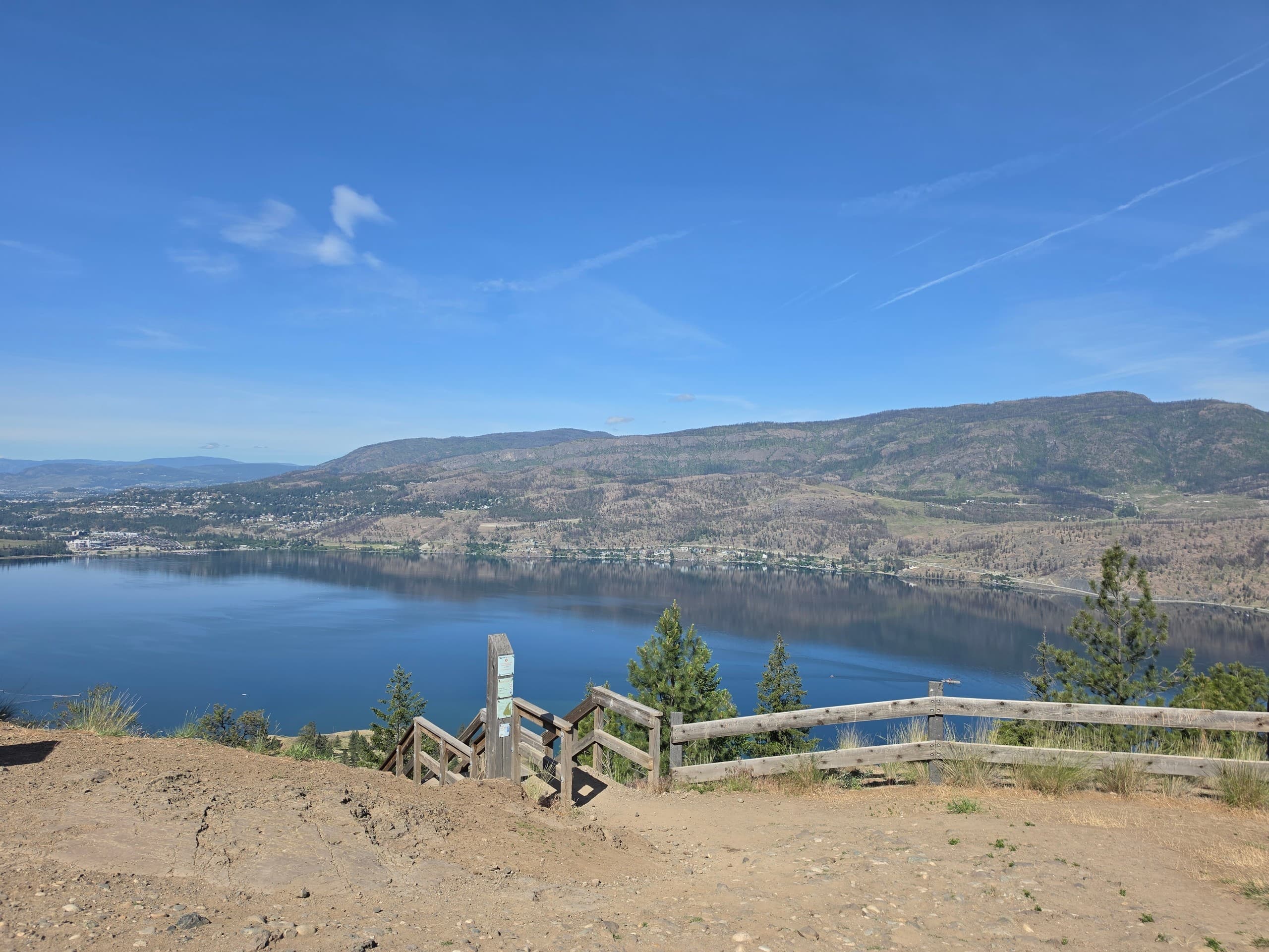 Scenic lakeside overlook with turquoise water and pines
