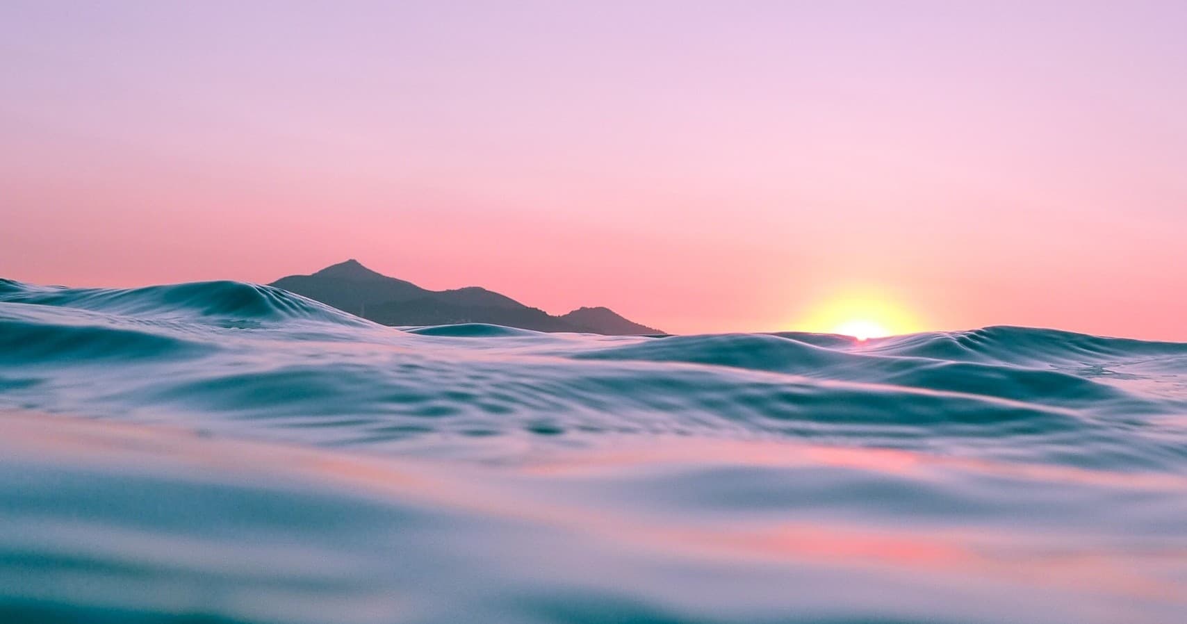 Ocean sunset over calm waves, scenic coastal horizon view