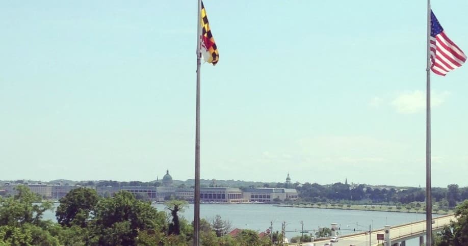 Maryland and US flags over Annapolis waterfront with harbor view