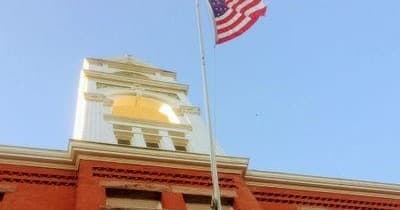 Historic clock tower and American flag, Bordentown walking tour