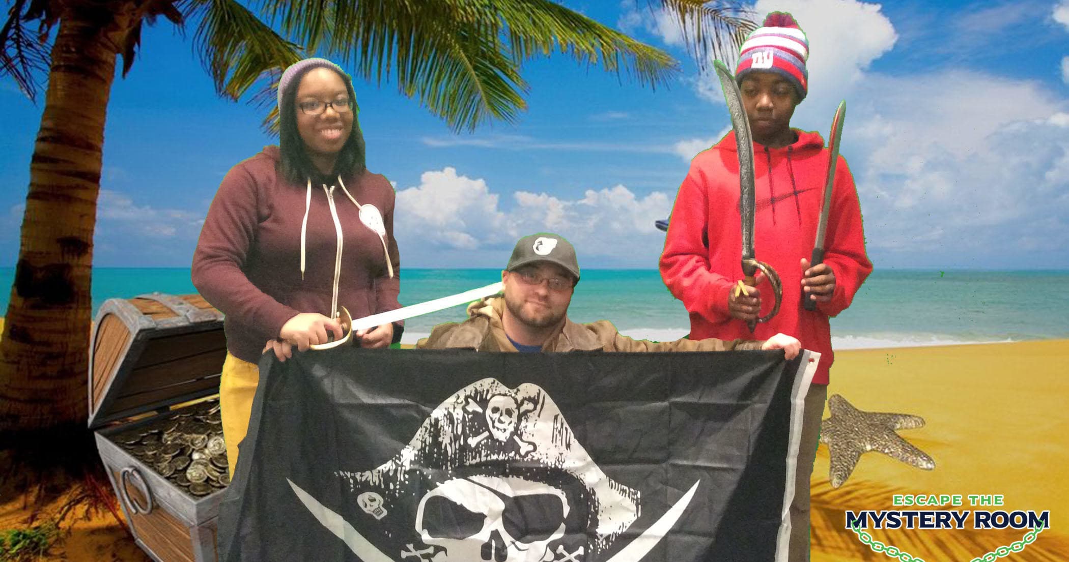 Team posing with pirate flag on tropical beach adventure