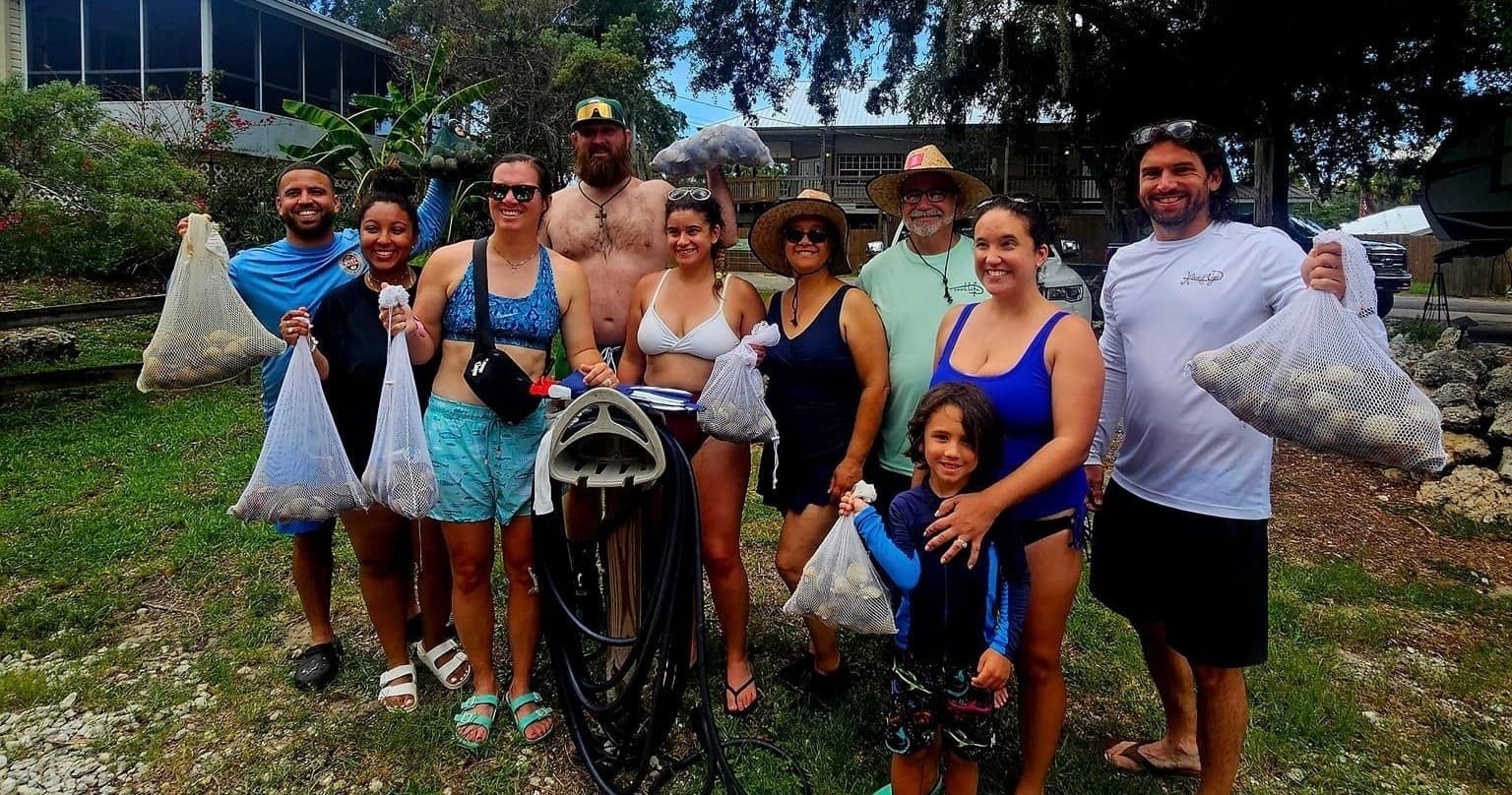 Group coastal cleanup and shell collecting on shoreline