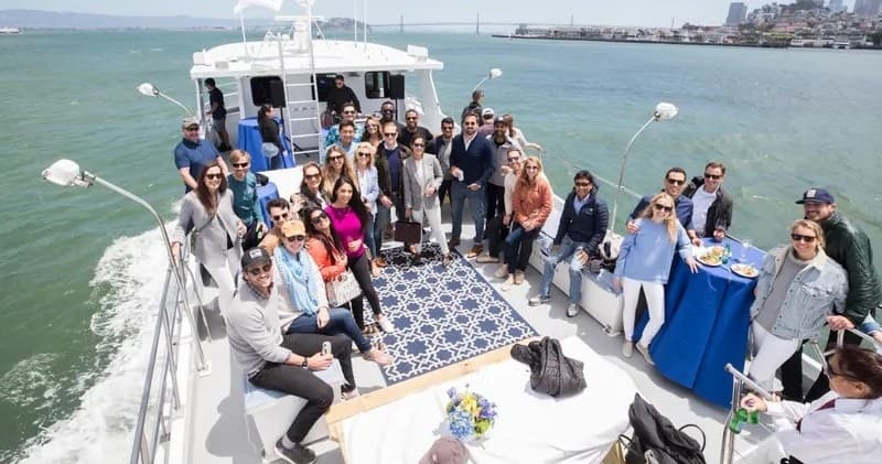 Group enjoying daytime yacht cruise on San Diego Bay deck