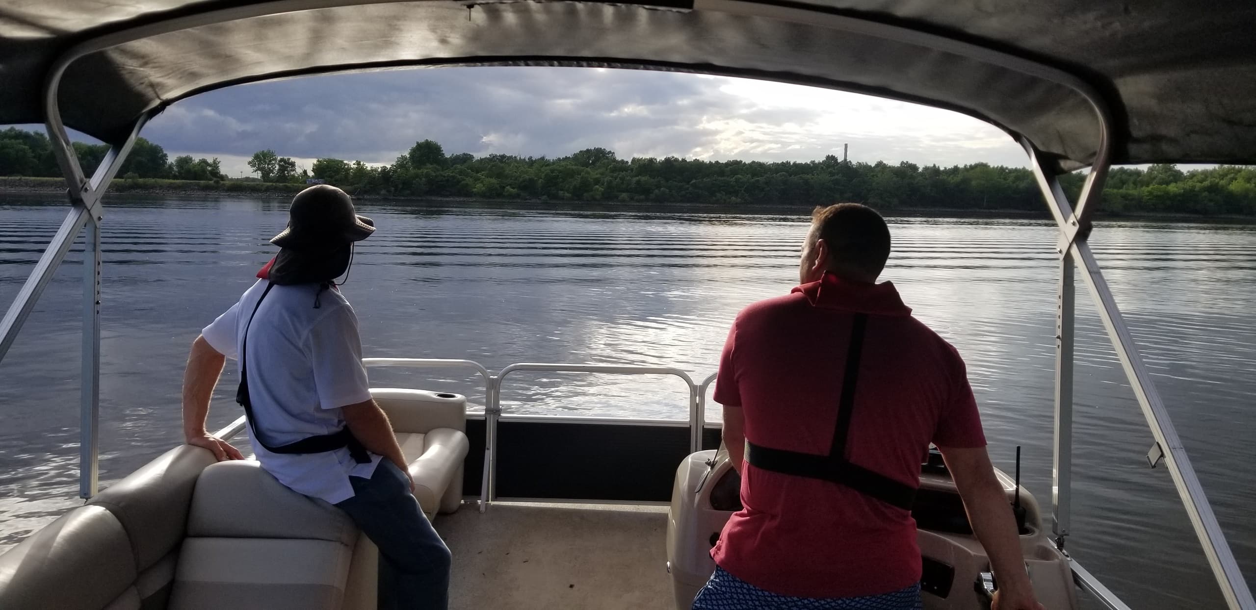Two passengers enjoying scenic river boating during training