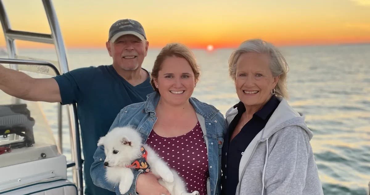 Family at sunset on charter boat, Florida Keys skyline