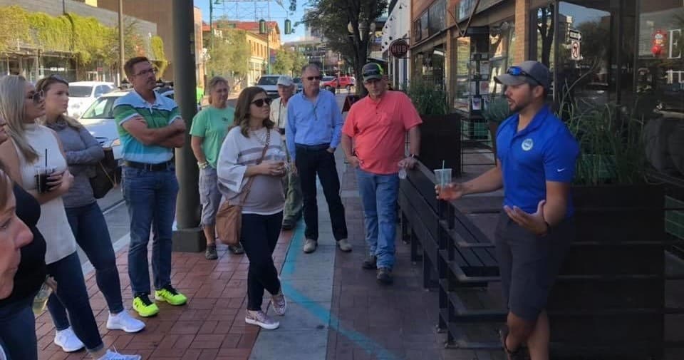 Guided Tucson walking food tour on historic downtown sidewalk