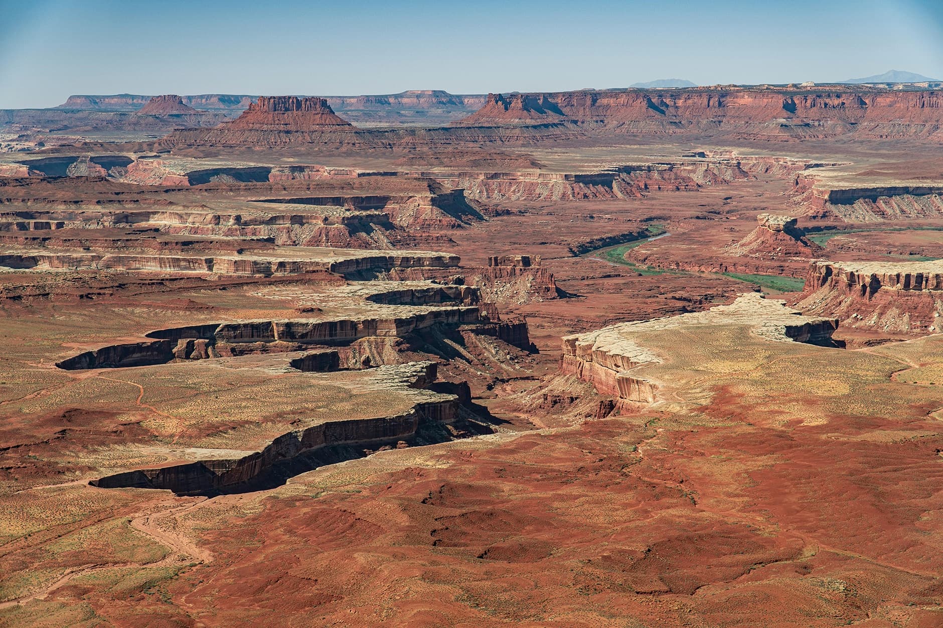 Aerial canyon vista of layered red rock canyons in Utah
