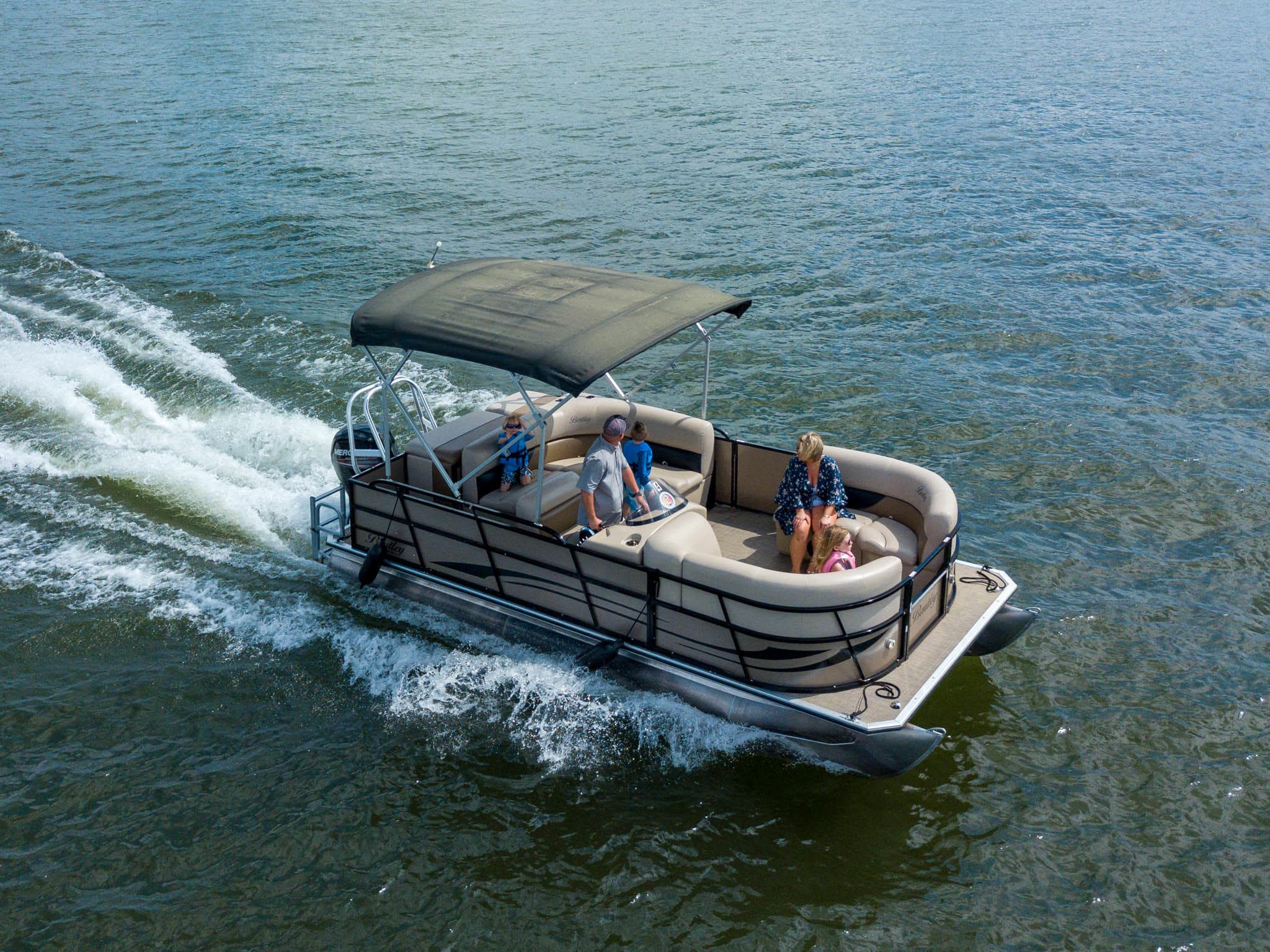 Pontoon boat underway on Carters Lake with passengers aboard