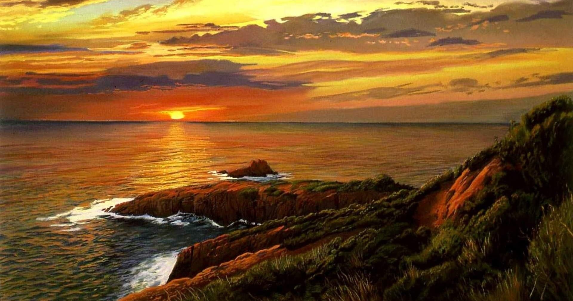 Sunset over Ramsey Island coastal cliffs with dramatic ocean vista