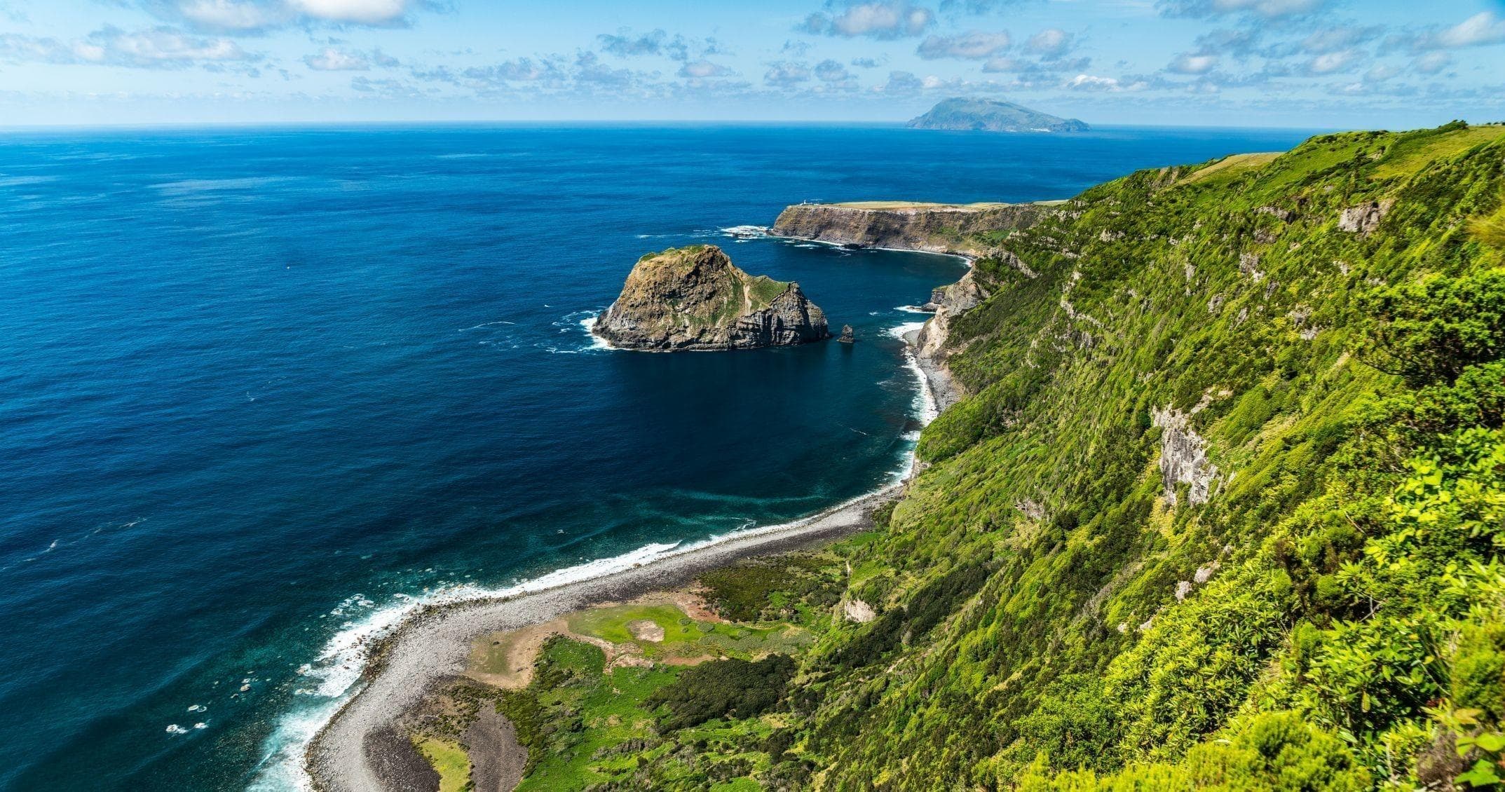 Aerial view of emerald coastline and winding shorelines