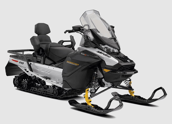 Two-up snowmobile on snowy trail, guided winter backcountry ride