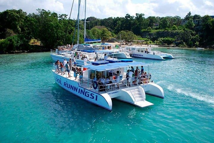 Dunn's River Falls Party Cruise & Snorkel from Negril — Catamaran, Open Bar & Waterfall Climb photo 1