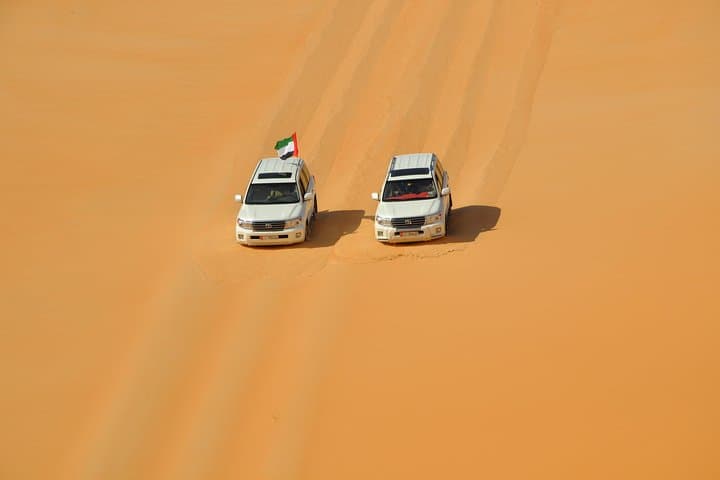 Evening Abu Dhabi Desert Safari: Dune Bashing, Camel Rides & BBQ Experience photo 2