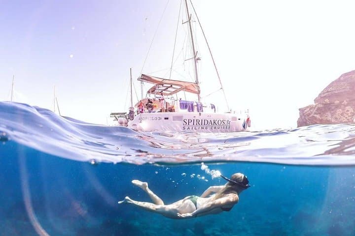 Santorini Private Catamaran Cruise: BBQ, Open Bar & Caldera Sail photo 3