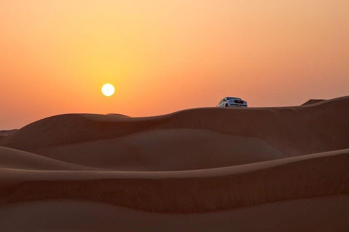 Dubai Sundowner Desert Safari — Private 4x4 Dune Bashing, Camel Ride & Evening Shows photo 1