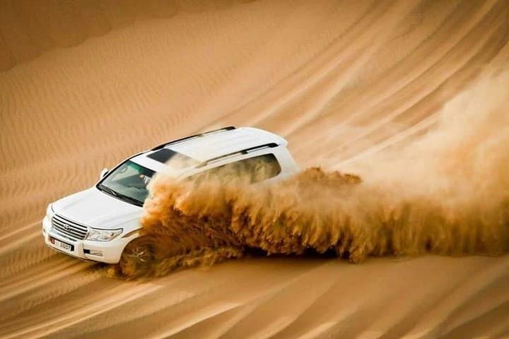 Evening Desert Safari in Abu Dhabi: Dune Bashing, Sandboarding & BBQ