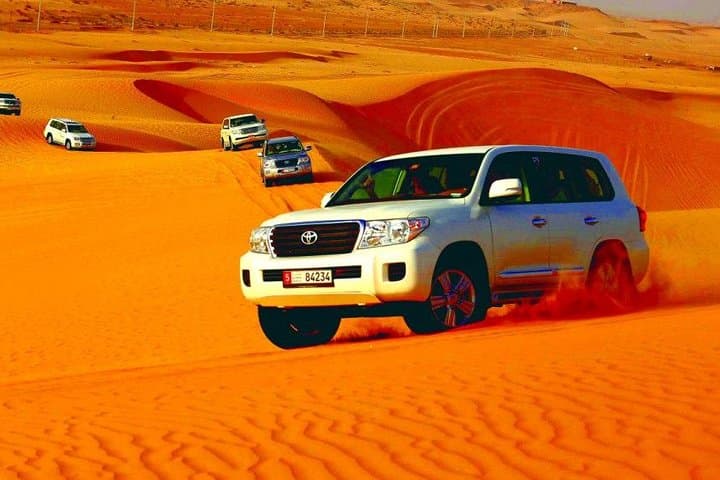Morning Abu Dhabi Desert Safari: Dune Bashing, Camel Ride & Sandboarding
