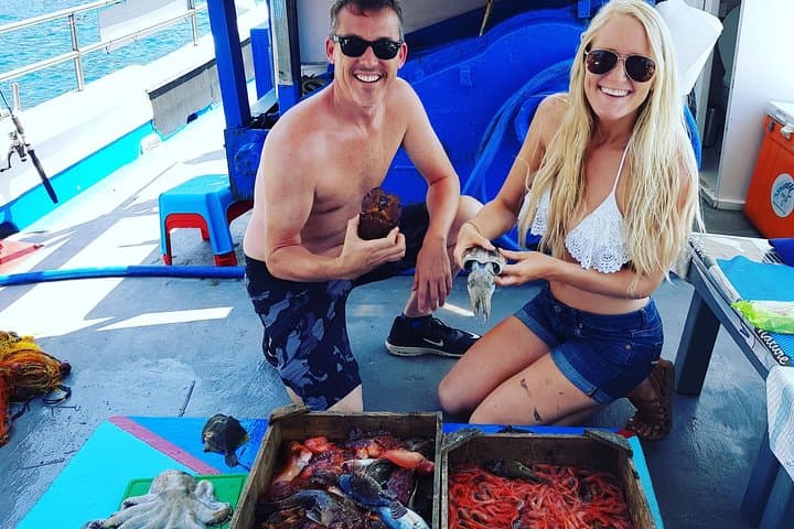 Santorini Traditional Fishing Experience: Semi-Private Boat, Snorkel & Cook Your Catch photo 1
