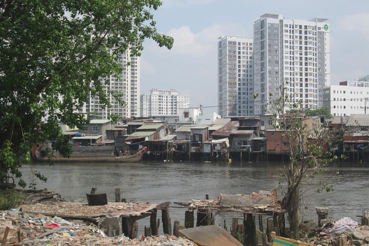 Scooter Through Saigon's Contrasts: Slum & Chillspots Tour with a Female Driver photo 4