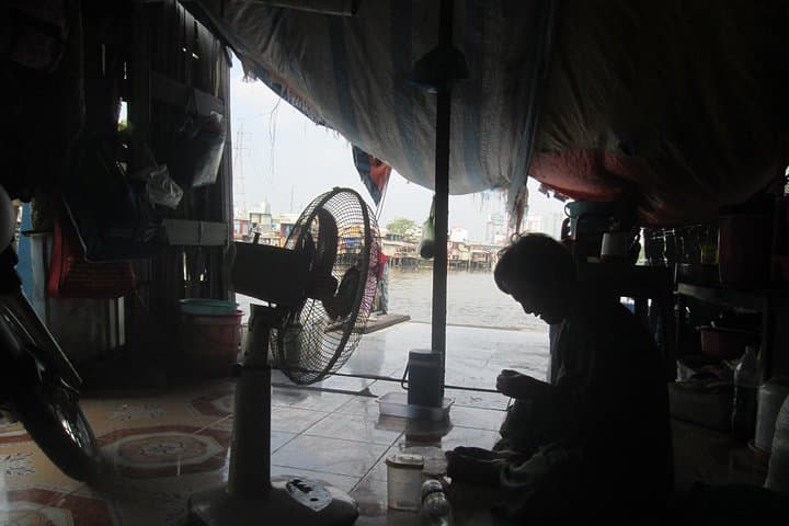 Scooter Through Saigon's Contrasts: Slum & Chillspots Tour with a Female Driver photo 5