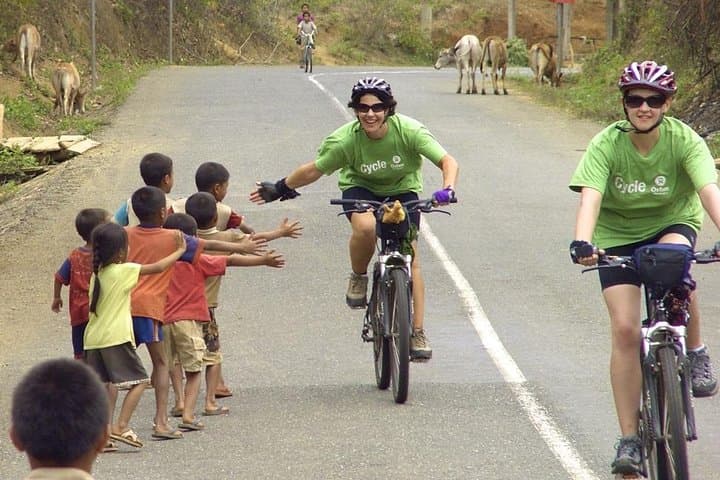 Bike to Kuang Si Waterfall and Return by Mekong Longtail: A One-Day Luang Prabang Adventure