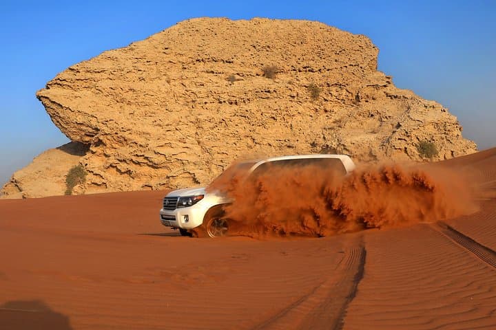 Dubai Red Dune Desert Safari: Dune Bashing, Camel Ride & BBQ Experience