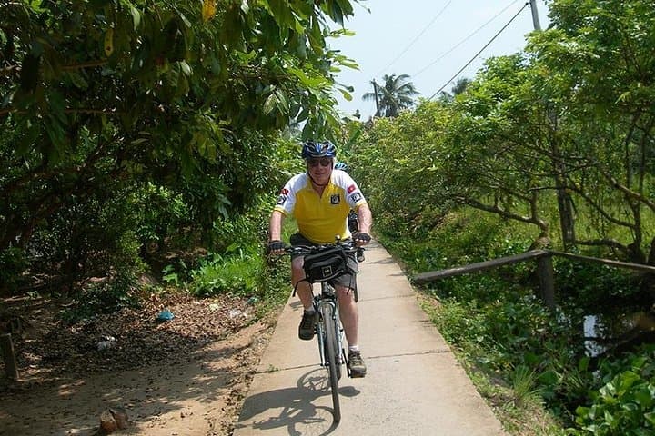 Mekong Delta Cycling to Cai Be: Full-Day Floating Market, Orchards & Local Lunch photo 1