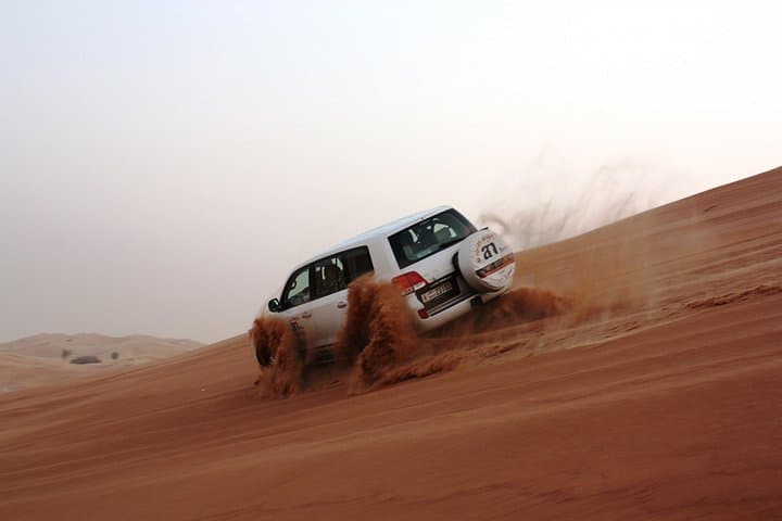 Morning Dubai Desert Safari — Dune Bashing, Sandboarding & Camel Ride photo 1