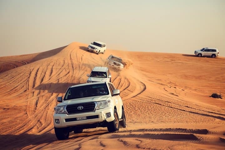 Dubai Desert Safari: Arabian Desert Experience with Dune Bashing, Camel Rides & Bedouin Camp