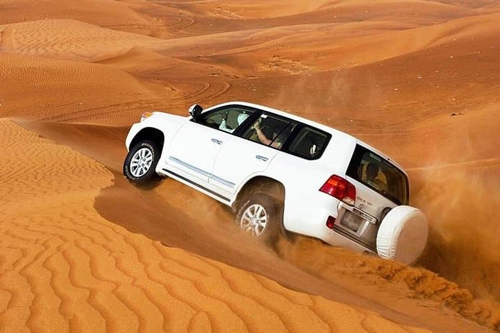 Sunset Dune Safari in Dubai: Dune Bashing, Camel Rides & Desert BBQ