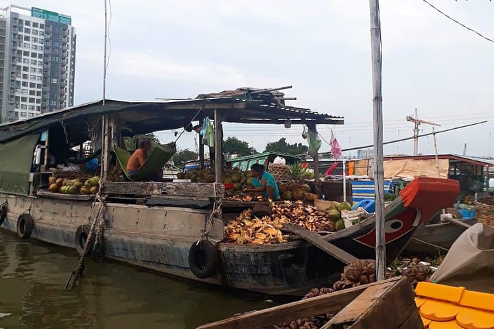 Scooter Through Saigon: Afternoon Food, Temples & Floating Market Tour photo 3