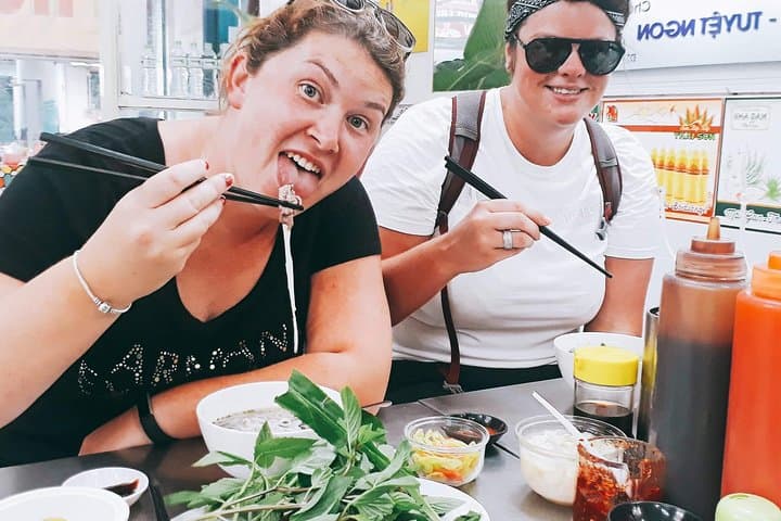 Scooter Through Saigon: Afternoon Food, Temples & Floating Market Tour photo 4