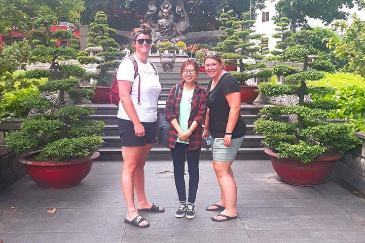 Scooter Through Saigon: Afternoon Food, Temples & Floating Market Tour photo 6