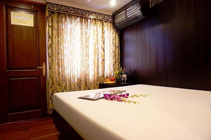 Overnight Bai Tu Long Bay Cruise: Ocean-View Cabins, Kayaking & Fishing photo 1