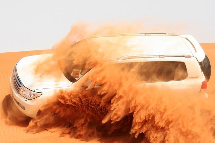 Morning Red Dunes Safari Dubai: Camel Trek, Dune Bashing & Sandboarding