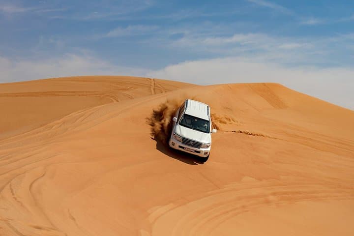 Dubai Morning Desert Safari & Camel Trek: Dune Bashing, Sandboarding and Camel Ride