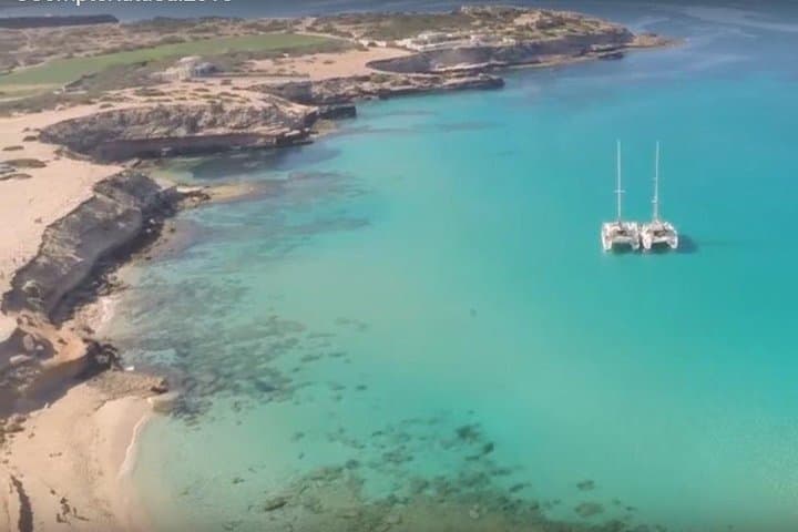 Private Catamaran to Cala Comte: Swim, Paddle & Sunset off Ibiza