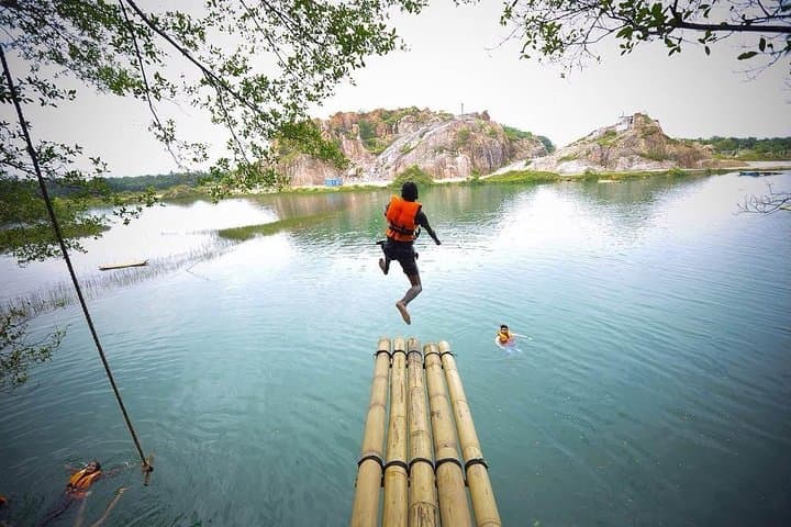 Stay in a Bamboo Hut at Tadom Hill Resort: Lakeside Swings, 5m Diving Platform & Rustic Camping photo 3
