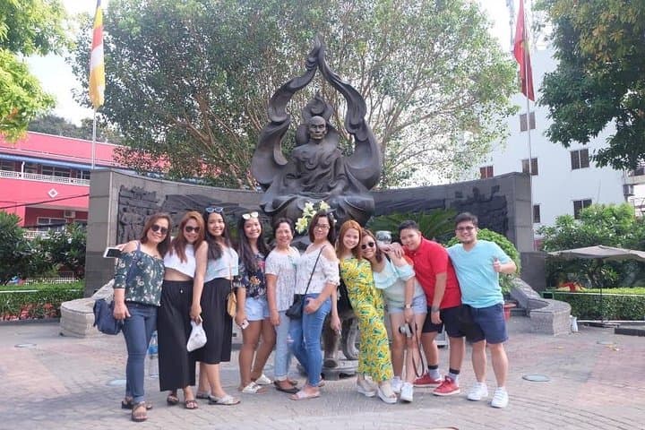 Scooter Through Saigon: Afternoon Historical Tour with Ao Dai Riders photo 3