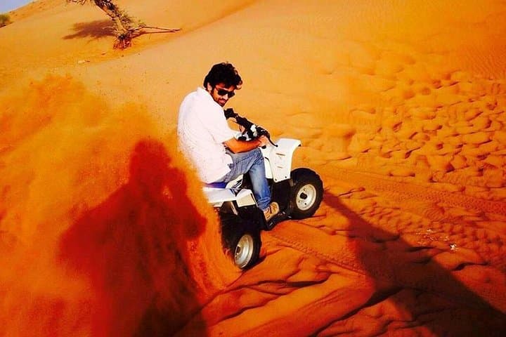 VIP Dubai Desert Safari with Quad Bike, Dune Bashing & Sunset BBQ photo 2