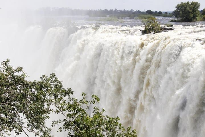 Victoria Falls Guided Tour from Livingstone, Zambia — Rainforest, Knife-Edge Bridge & Boiling Pot photo 1