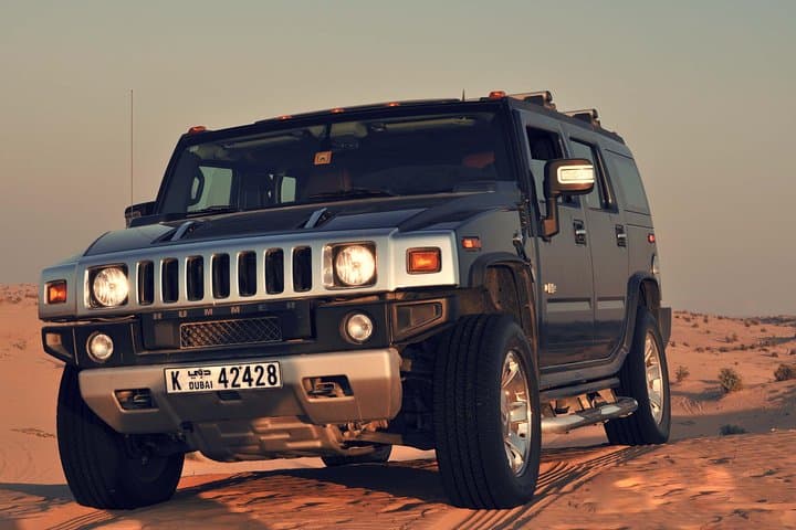 Private Morning Hummer Desert Safari in Dubai: Dune Bashing, Camel Ride & Sandboarding photo 2